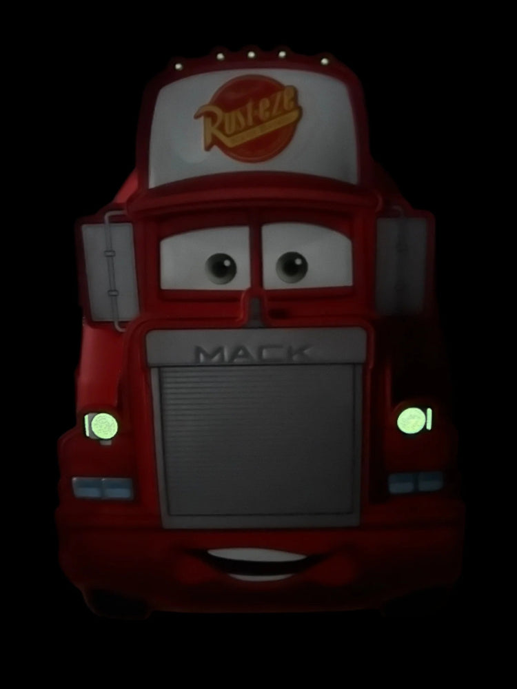 Animated character of a red Mack truck with a visible brand logo on a black background