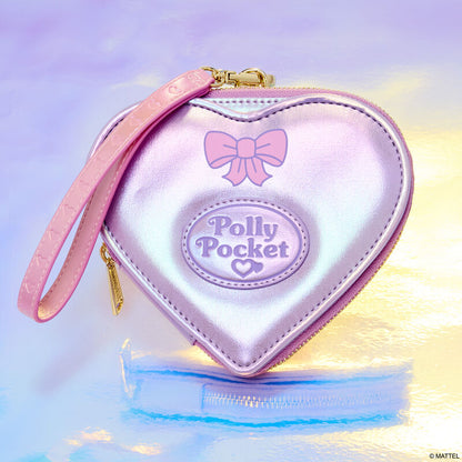Heart-shaped pink pouch with 'Polly Pocket' branding on a gradient background
