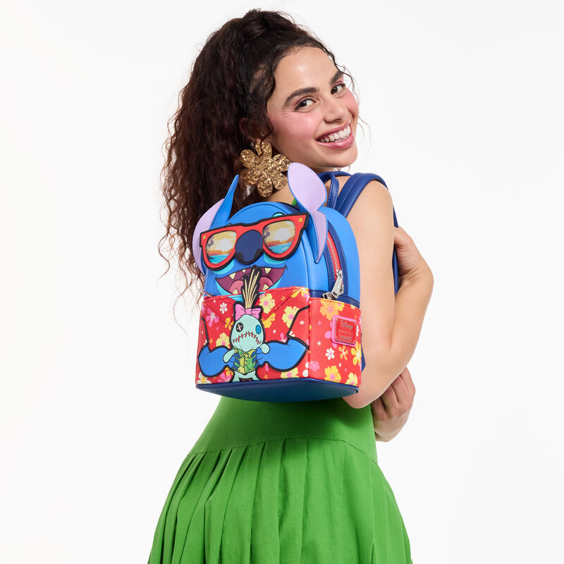 Person wearing a colorful backpack with cartoon design on a white background