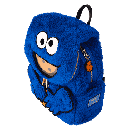 Blue furry backpack with a smiling face design on a white background
