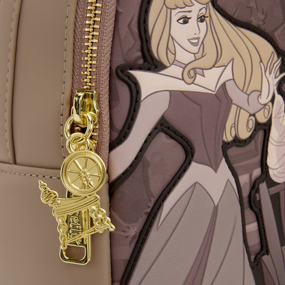 Gold charm attached to a bag with an illustration of a princess character.
