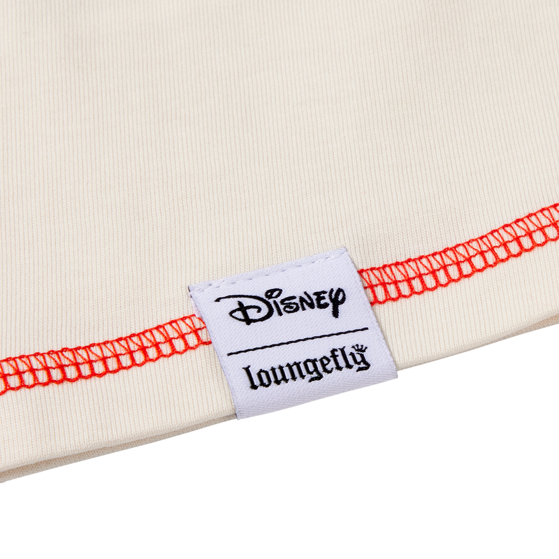 Close-up of a Disney Loungefly label on a product with red stitching.