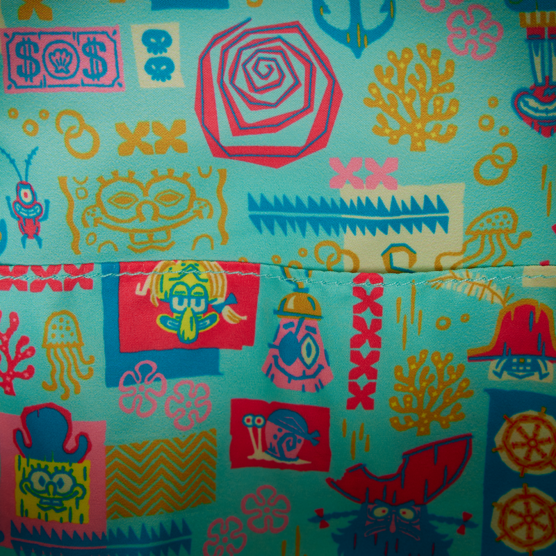 Colorful patterned fabric with various designs on a blue background