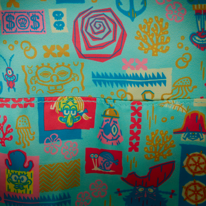 Colorful patterned fabric with various designs on a blue background