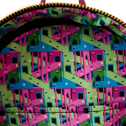 Close-up of a colorful geometric patterned bag with pink and blue shapes on a green background.