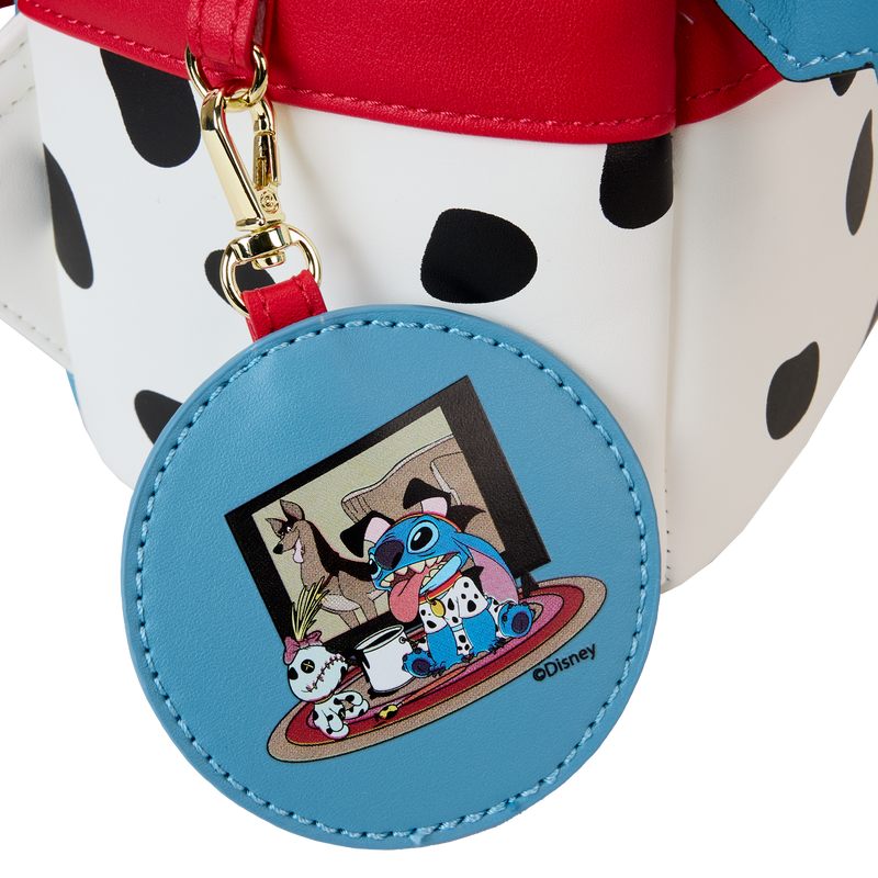 Blue round keychain with cartoon characters on a polka dot bag
