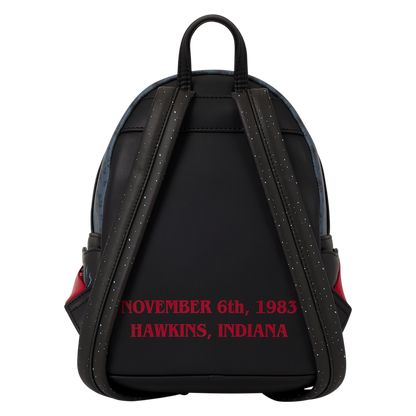 Black backpack shown from the back with red text reading 'NOVEMBER 6th, 1983 HAWKINS, INDIANA' on a white background.
