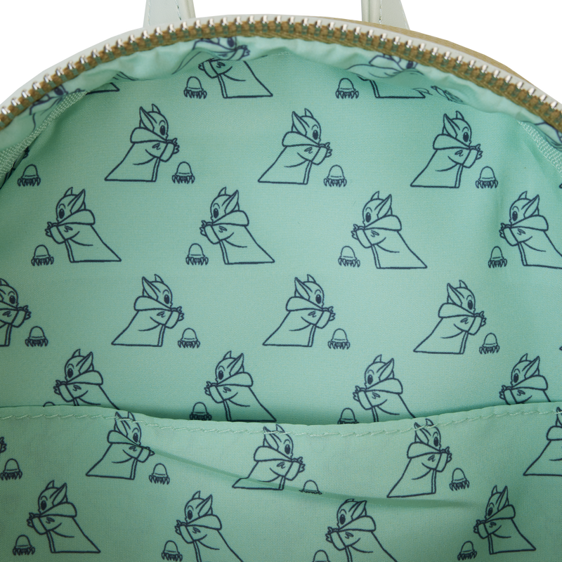 Green bag with a pattern of cartoon characters on a white background