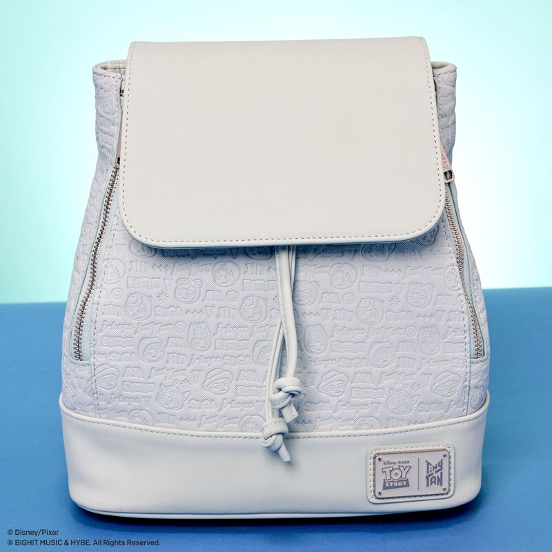 Light gray textured backpack with a drawstring on a blue background