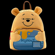 Yellow bear-shaped backpack with a honey design on a white background