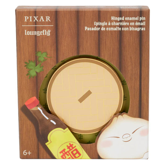 Pixar-themed enamel pin packaging with a wooden background