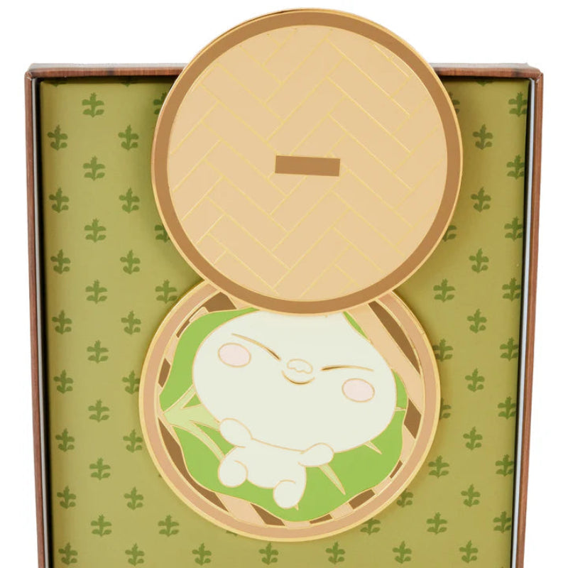 Compact mirror with a cartoon character design on a green patterned background