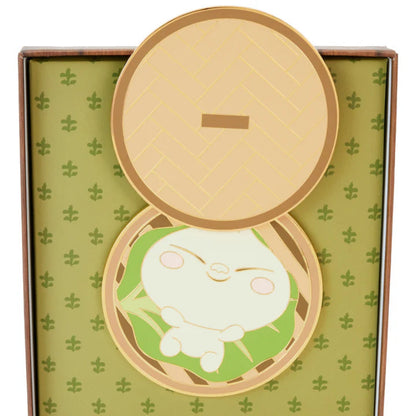 Compact mirror with a cartoon character design on a green patterned background