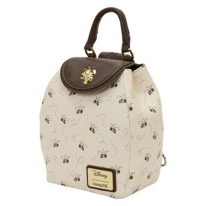 Beige backpack with bee pattern and brown top flap on a white background