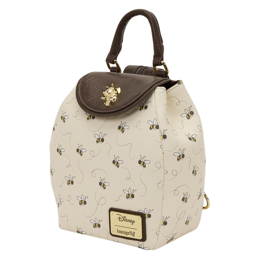 Beige backpack with bee pattern and brown top flap on a white background
