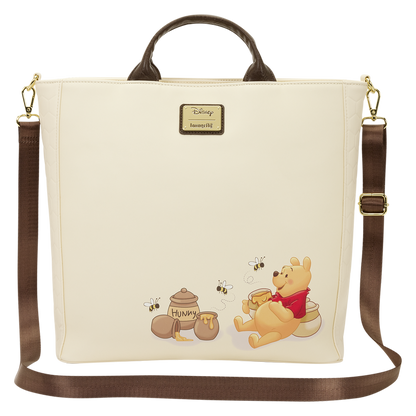 Beige bag with cartoon bear design featuring honey pots and bees, Disney logo visible.