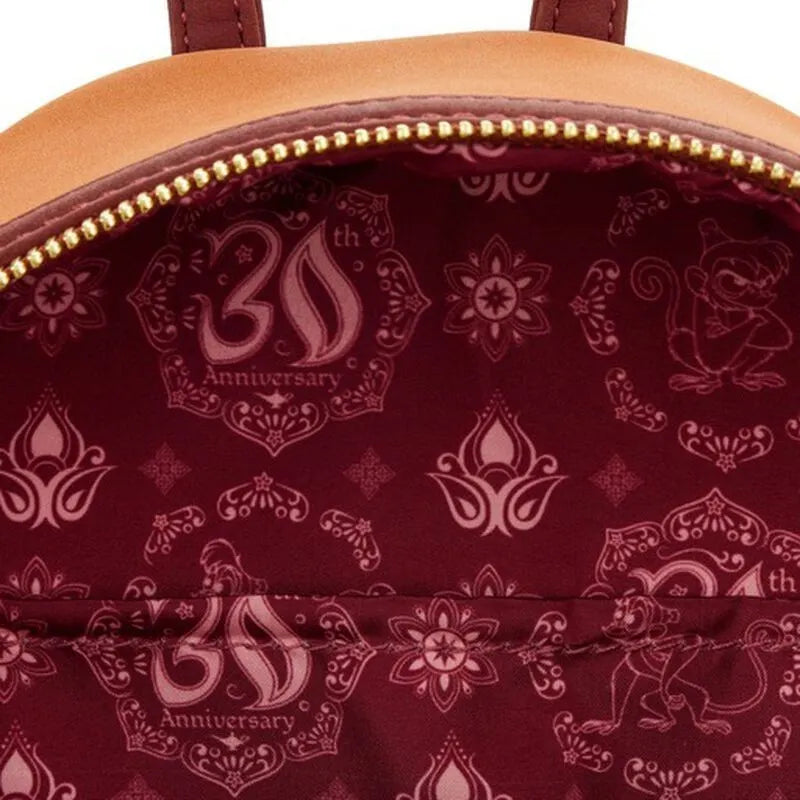 Close-up of a bag with decorative patterns and '30th Anniversary' text on a maroon background.