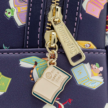 Close-up of a gold zipper with a charm on a navy blue bag with cartoon character design.