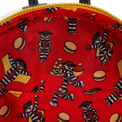 Red bag with cartoon character and food item pattern on a red background