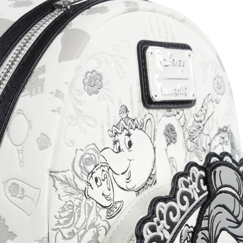 Mini backpack with black and white designs featuring characters and floral patterns, with a visible Disney logo.