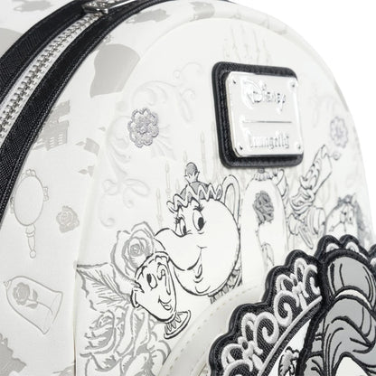 Mini backpack with black and white designs featuring characters and floral patterns, with a visible Disney logo.