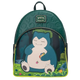 A Loungefly Pokémon Snorlax backpack featuring a large graphic of Snorlax sitting in a forest on the front pocket, with a dark green embossed top panel and lime green accents.
