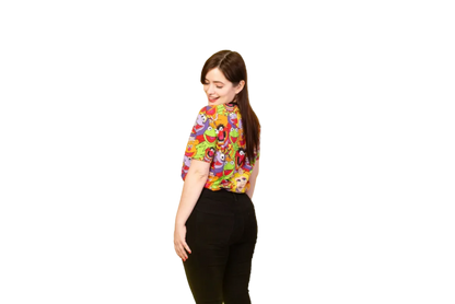 Person wearing a colorful shirt with cartoon characters on a yellow background