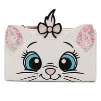 A white faux-leather clutch purse designed like a cat face, featuring large embroidered blue eyes, a pink nose, whiskers, floral-patterned ears, and a pink bow on top.