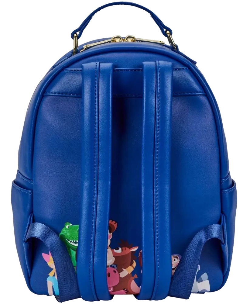 A royal blue faux leather backpack featuring a printed collage of Disney's Toy Story characters along the bottom edge, shown against a plain white background.