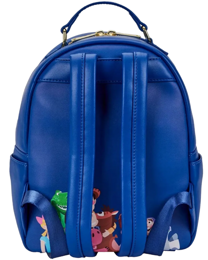 A royal blue faux leather backpack featuring a printed collage of Disney's Toy Story characters along the bottom edge, shown against a plain white background.