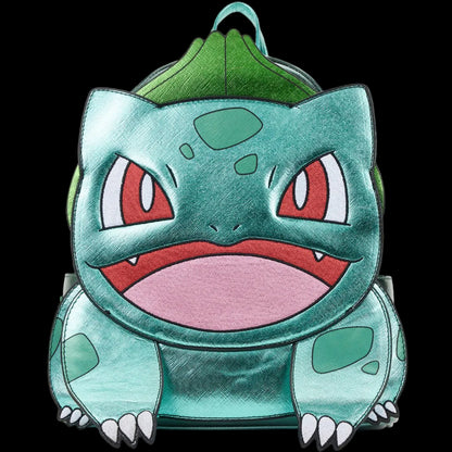 A Bulbasaur character backpack designed to look like the Pokémon character, featuring metallic teal-green skin, a green leaf crest on top, red eyes, and a pink mouth, shown against a plain white background.
