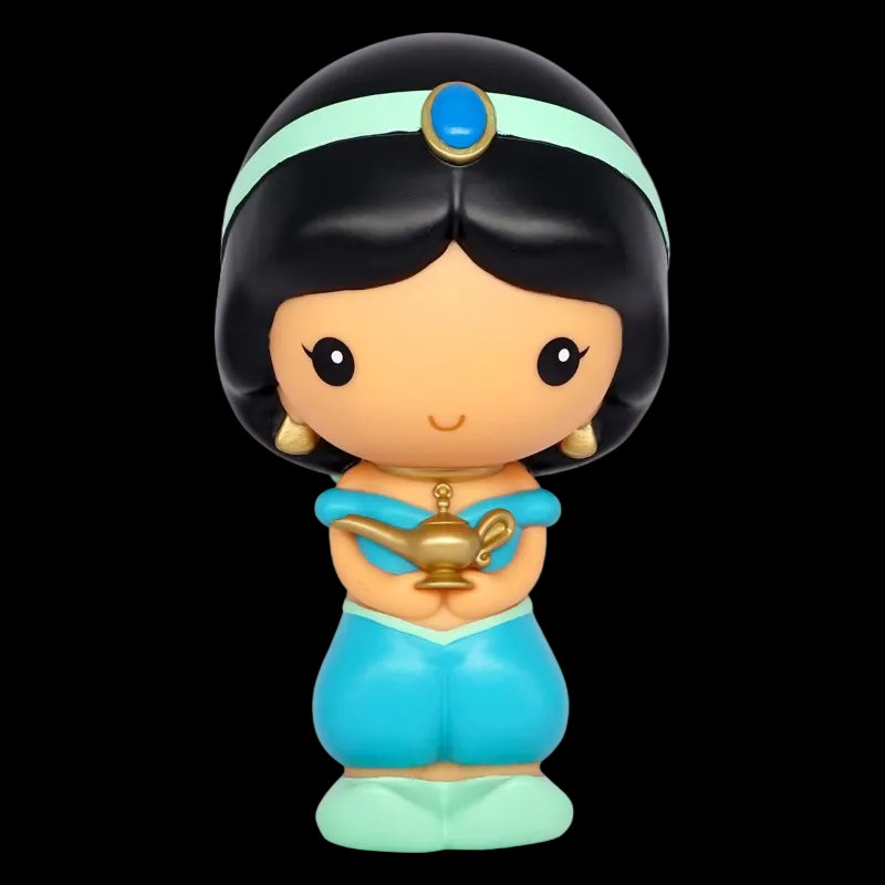 Toy figure of a character in a blue dress with a green headband on a white background