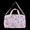 Pink duffel bag with cartoon animal and flower pattern on a white background