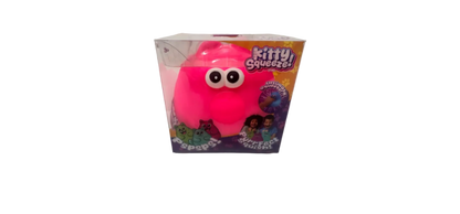 Pink plush toy with googly eyes in a clear box on a white background