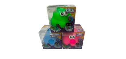 Green and pink 'Kitty Squish' toys with packaging on a white surface.