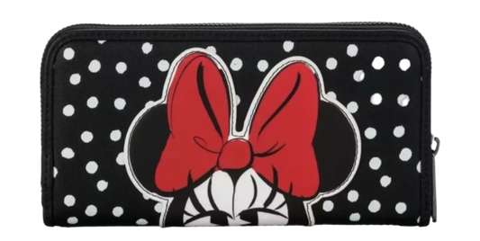 Black wallet with white polka dots and red bow design on a white background