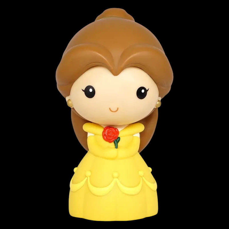 Toy figure of a character in a yellow dress with a red rose on a white background