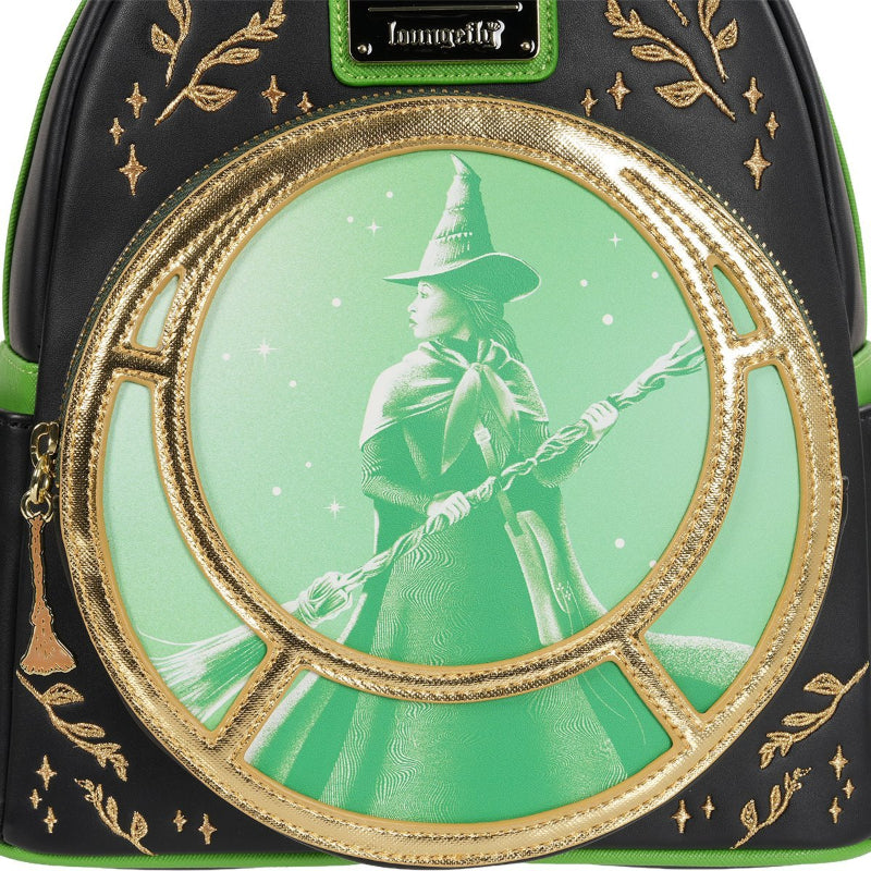 Backpack with a witch design and gold accents on a green background