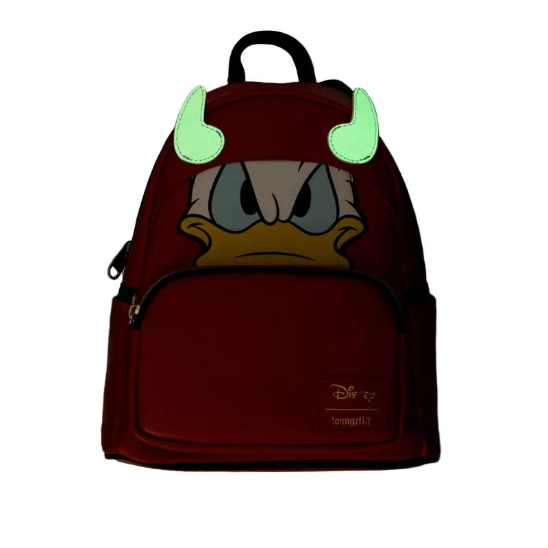 Backpack with cartoon character face and glowing green horns on a dark background