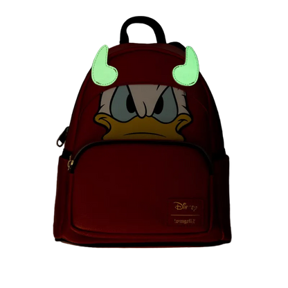 Backpack with cartoon character face and glowing green horns on a dark background