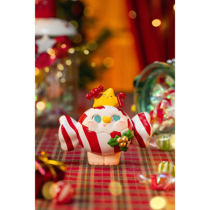 Christmas-themed figurine with candy cane design on a festive background