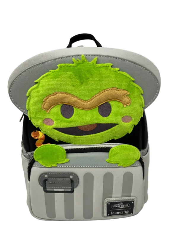 Backpack with a green character on top against a white background