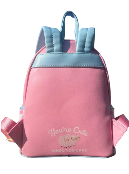 Pink backpack with blue accents on a blue background