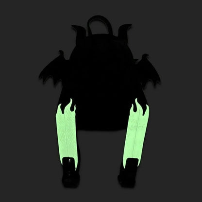 A black backpack with bat-like wings and small horns, shown from the back on a dark gray background. The backpack's two long vertical straps glow bright green in the dark.