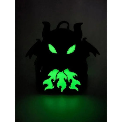 A black backpack shaped like a devil or demon head with glowing green eyes and mouth details, shown against a dark background.