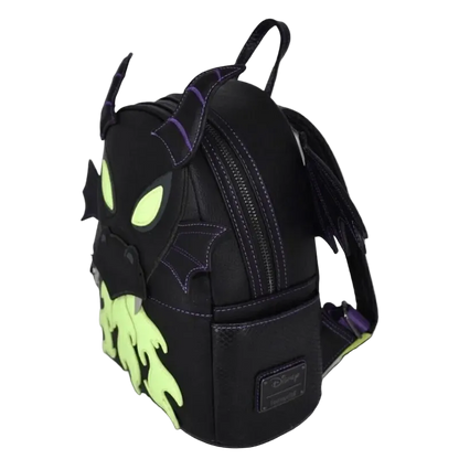 A black faux-leather Disney Nightmare Before Christmas mini backpack shaped like Malice, featuring neon green glowing eyes and mouth details, purple stitching, and bat-wing accents, shown on a plain white background.