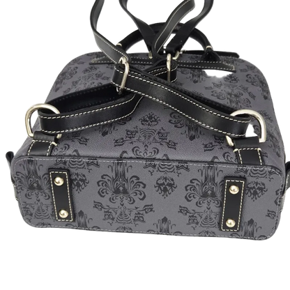 A dark gray and black damask-patterned handbag with black leather straps, silver-tone metal hardware, and white contrast stitching, shown against a plain white background.