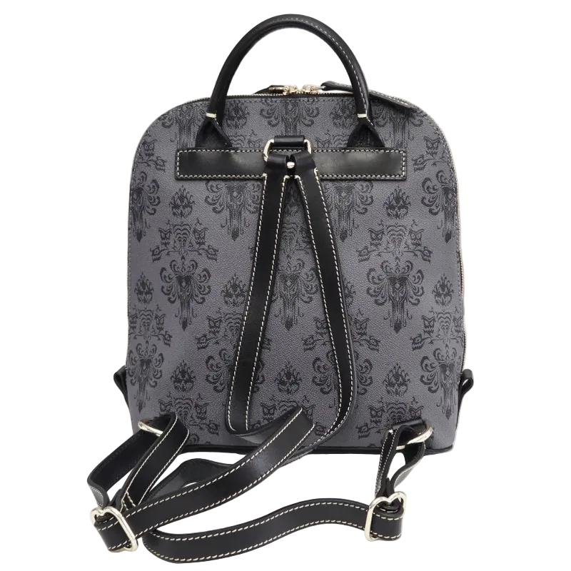 A gray and black damask-patterned backpack with black leather handles, trim, and adjustable shoulder straps, displayed on a white surface against a light gray background.