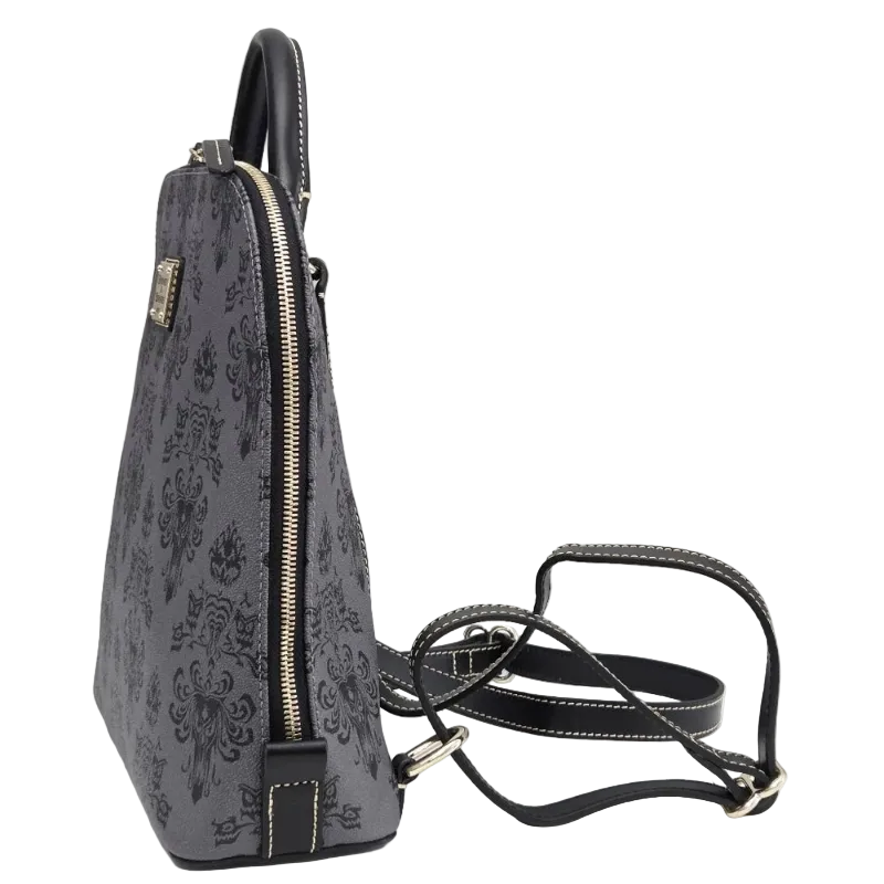 A dark gray and black damask-patterned handbag with gold-tone hardware, shown with its black shoulder strap on a light gray background.