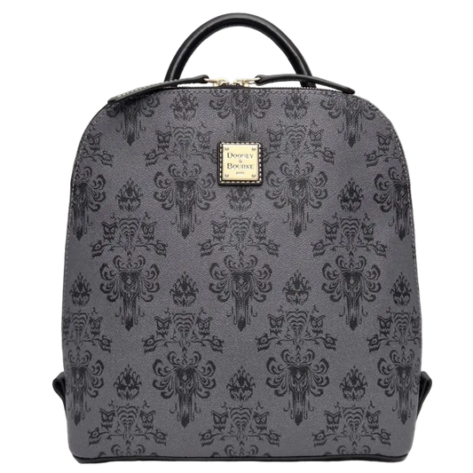 A gray and black damask-patterned backpack with a top handle and a gold-tone Disney on Parade logo plaque on the front, set against a neutral gray background.